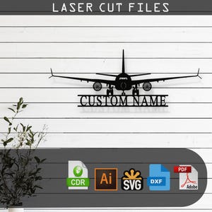 May include: Black silhouette of an aeroplane with the text "CUSTOM NAME" underneath. The image is on a white wood background. The file formats available are CDR, AI, SVG, DXF, and PDF.