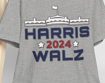May include: A gray t-shirt with a white silhouette of the White House and the text "HARRIS 2024 WALZ" in blue and red.