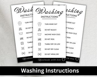 May include: Three white cards with black text and symbols outlining washing instructions. The cards read "Washing Instructions" and include symbols for turning inside out, do not bleach, machine wash cold, do not iron, tumble dry low, do not dry clean, and do not wring dry. The cards also include the text "Handmade with love".