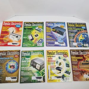 May include: Eight issues of Popular Electronics magazine arranged in two rows. The covers feature various electronic project themes, including climate controllers, op-amps, capacitance meters, radio propagation, signal generators, and clocks.