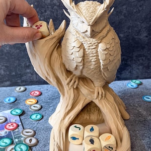 Owl dice tower with Wingspan food dice being placed in dice tower, board game accessory