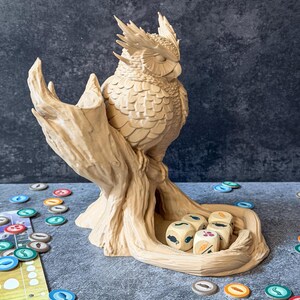 Owl dice tower side view on game board with colorful tokens, tabletop RPG accessory