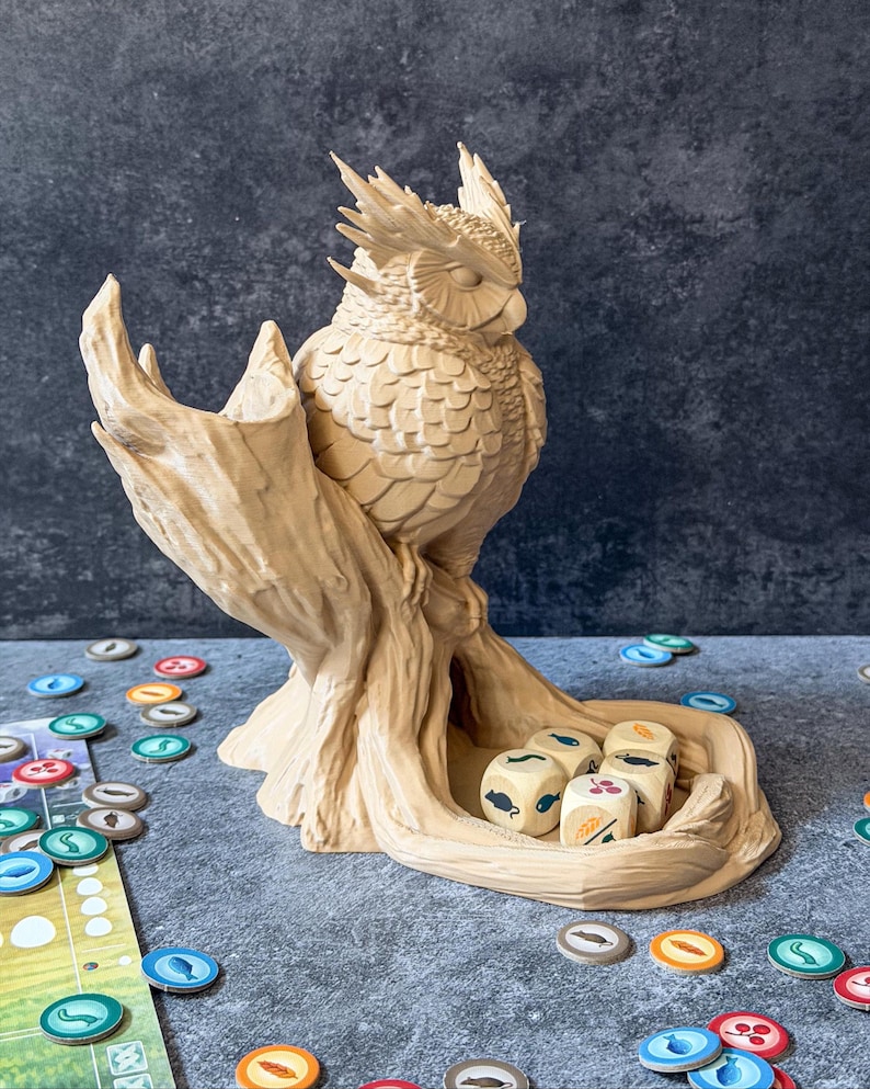 Owl dice tower side view on game board with colorful tokens, tabletop RPG accessory