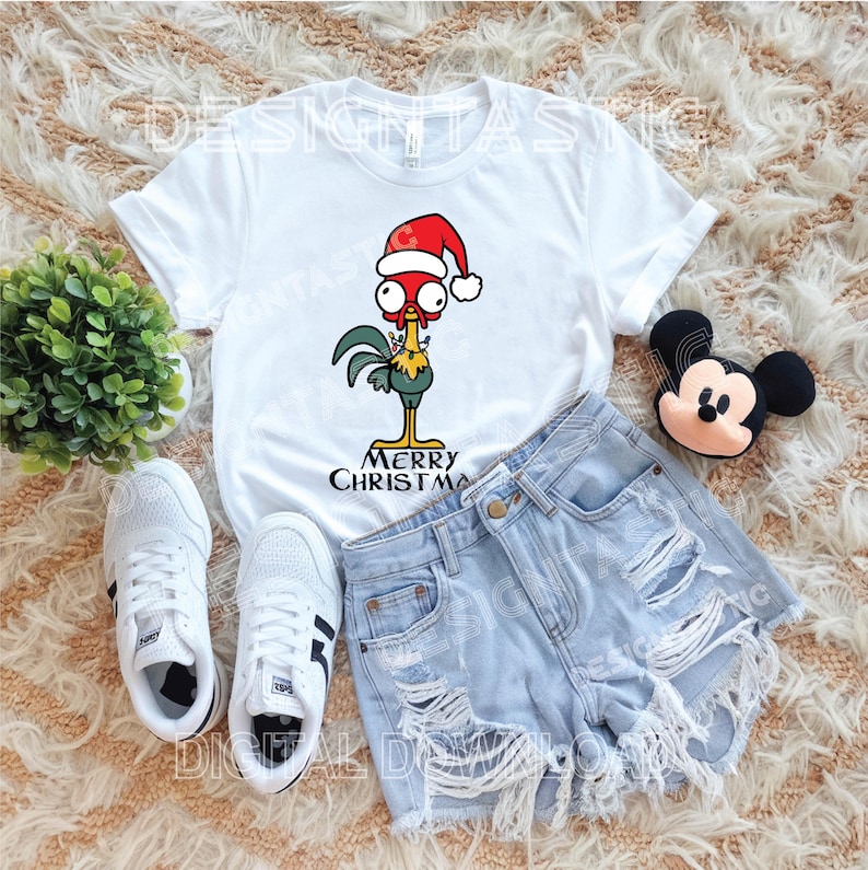 May include: White t-shirt with a cartoon rooster in a Santa hat, and the words "MERRY CHRISTMAS". Accompanied by light blue denim shorts, white trainers, and a Mickey Mouse soft toy. A festive holiday theme.