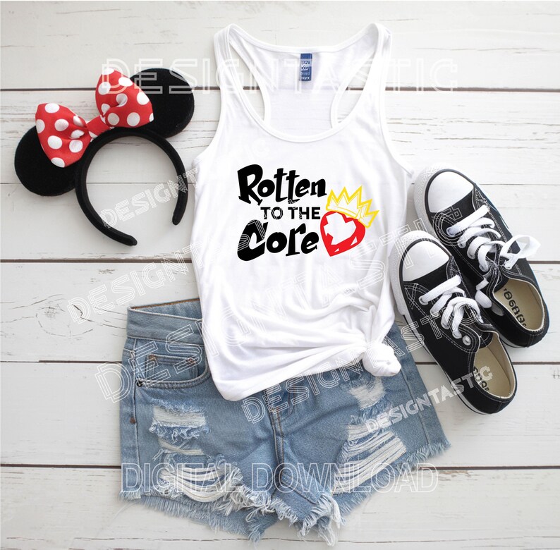 May include: A white tank top with the text "Rotten to the Core" and a heart graphic, paired with denim shorts, black sneakers, and a Minnie Mouse ear headband with a red polka dot bow. A casual outfit.