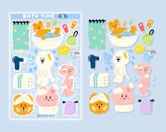 May include: A set of 12 bath time themed stickers featuring cute cartoon animals, bath products, and towels. The stickers are on a blue background with a grid pattern. The text "BATH TIME 1" is at the top of the sheet.