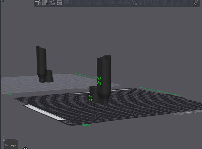 May include: A 3D render of a black, cylindrical object with a smaller base, set on a gridded surface. Green cross markers are visible. The background is a plain grey colour.