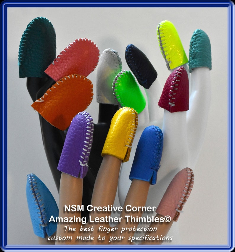 May include: A collection of colorful leather thimbles in various colors, including teal, orange, red, gray, black, green, purple, yellow, blue, and pink. The thimbles are displayed on a hand-shaped mannequin. The text "NSM Creative Corner Amazing Leather Thimbles&reg; The best finger protection custom made to your specifications" is displayed at the bottom of the image.