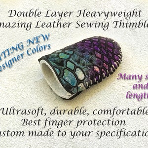 May include: Double layer heavyweight leather sewing thimble with a blue and purple mosaic design. The thimble is rolled up and the text "EXCITING NEW Designer Colors" is visible in the top left corner. The text "Many sizes and lengths" is visible in the bottom right corner. The text "Ultrasoft, durable, comfortable Best finger protection Custom made to your specifications" is visible in the bottom centre of the image.
