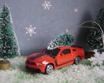 Ford Mustang Boss 302 (orange) with Christmas tree ornament