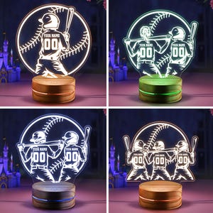 May include: Four different baseball-themed night lights with a white base and a clear acrylic design. The lights feature baseball players with the text "YOUR NAME" and "00" on their jerseys.