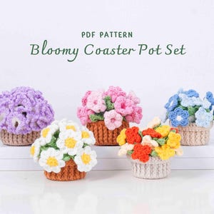 May include: A collection of five crocheted flower pot coasters in various colors: purple, pink, white, blue, and yellow. Each coaster features a basket-like base and is adorned with crocheted flowers. The text "PDF PATTERN" and "Bloomy Coaster Pot Set" is visible.