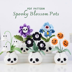 May include: A collection of handmade crochet "Spooky Blossom Pots" featuring various Halloween-themed flowers and ghost-like accents. The pots are white with skull designs. The flowers include purple skull flowers, blue eye flowers, and orange jack-o'-lantern flowers.