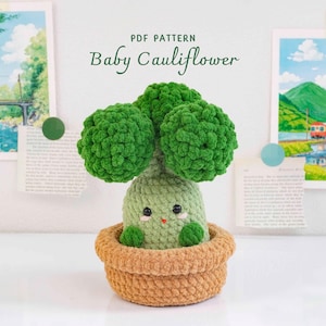 May include: A crochet amigurumi of a baby cauliflower with a light green body, dark green florets, and a tan pot. The figure has black bead eyes, pink cheeks, and a small red mouth. Text above reads: PDF PATTERN Baby Cauliflower.