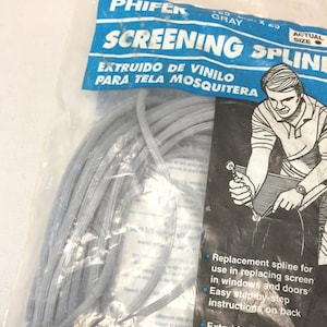 May include: A package of gray screening spline, with the text "SCREENING SPLINE" in blue and white. The package also includes the text "EXTRUIDO DE VINILO PARA TELA MOSQUITERA". The package includes instructions for use.