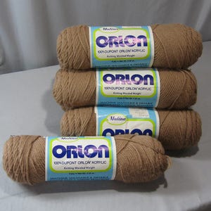 May include: Four skeins of brown yarn labeled "Mulina Orlon 100% DuPont Orlon Acrylic Knitting Worsted Weight Machine Washable & Dryable"