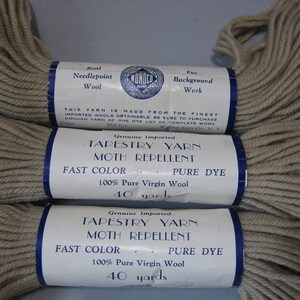 May include: Three skeins of beige tapestry yarn with labels that read "Genuine Imported Tapestry Yarn Moth Repellent Fast Color - Pure Dye 100% Pure Virgin Wool 40 yards".