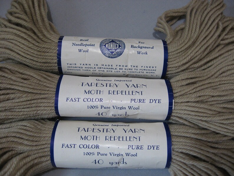 May include: Three skeins of beige tapestry yarn with labels that read "Genuine Imported Tapestry Yarn Moth Repellent Fast Color - Pure Dye 100% Pure Virgin Wool 40 yards".