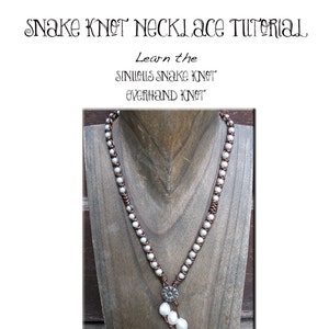 May include: A tutorial for making a snake knot necklace using white pearls and brown cord. The image shows the finished necklace on a wooden mannequin. The text on the image reads "Snake Knot Necklace Tutorial" and "Learn the Sinuous Snake Knot Overhand Knot" and "By Laura Gasparrini".