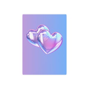 May include: Two iridescent, metallic heart-shaped objects with a smooth, reflective surface. The hearts feature a gradient of purple, pink, and blue tones, set against a vertical background that transitions from soft purple to a bright sky blue.