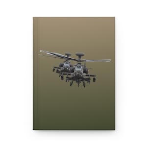 May include: Three military helicopters flying in formation against a muted green and brown background. The helicopters are dark gray and have a camouflage pattern.