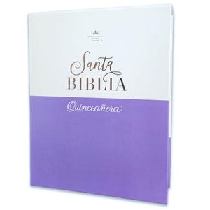 May include: A white and purple book with the title "Santa Biblia Quinceañera" in gold lettering. The book is a religious gift for a young woman celebrating her 15th birthday.