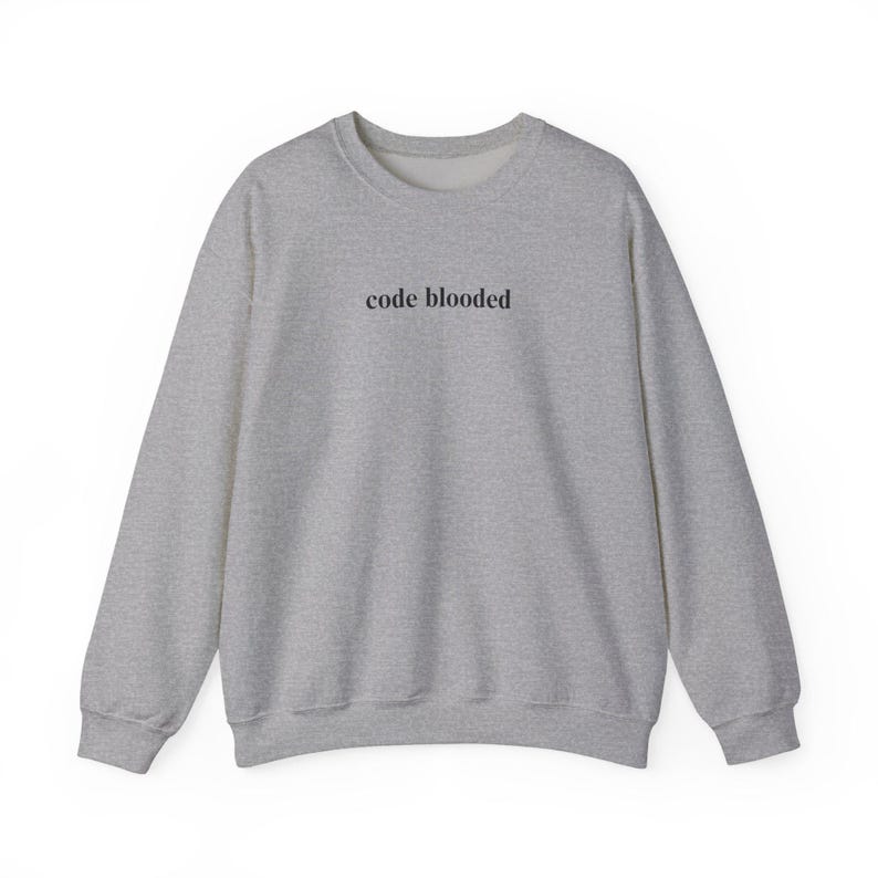 May include: A heather gray sweatshirt with the text "code blooded" printed in black across the chest. The long-sleeved crew neck top is made of a soft material.