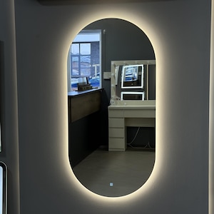 Elegant Oval LED Backlit Mirror, Modern Wall-Mounted Vanity Mirror with Ambient Lighting, Perfect for Bathrooms and Home Decor