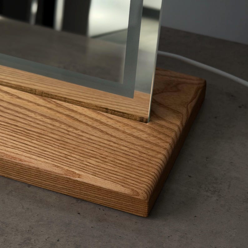 Handmade wooden mirror stand with frameless square mirror close-up texture detail