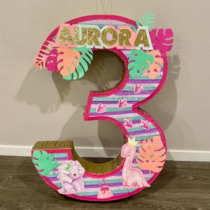 Custom personalized piñata. Number piñata, character piñata, and different designs. Dinosaur piñata