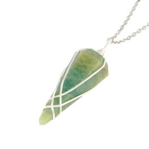 May include: A green and yellow gemstone pendant with a silver-colored wire wrap and chain. The pendant is a pointed, elongated shape. The chain is a delicate, silver-colored ball chain.
