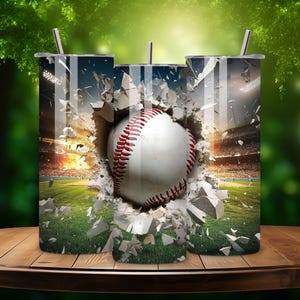 May include: Three stainless steel tumblers with a baseball breaking through a wall design. The baseball is white with red stitching and is surrounded by broken concrete.