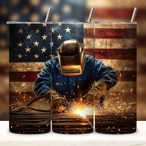 May include: A stainless steel tumbler with a design of a welder working on metal with sparks flying. The background is an American flag.