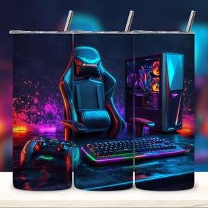 May include: A set of three stainless steel tumblers with a gamer theme. The tumblers feature a gaming chair, a computer, a keyboard, and a controller. The background is a dark blue with neon lights.