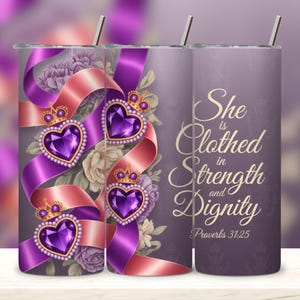 May include: A stainless steel tumbler with a decorative design. The design features purple heart-shaped jewels with gold crowns, purple and pink ribbons, and floral accents. The text "She is Clothed in Strength and Dignity" is also displayed.