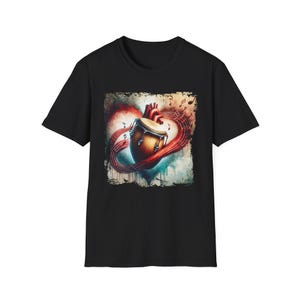 May include: Black t-shirt featuring a graphic of a heart with a conga drum at its center, surrounded by musical notes. The design incorporates red, brown, and white colors, with a distressed border. The shirt is made of a soft material.