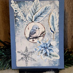 Biglietti di Natale in stile vintage con sfondo di fiocchi di neve blu