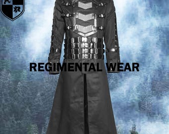 May include: Black long coat with silver accents and multiple buckles. The coat features a high collar and is labeled "REGIMENTAL WEAR". The coat has a military-inspired design.
