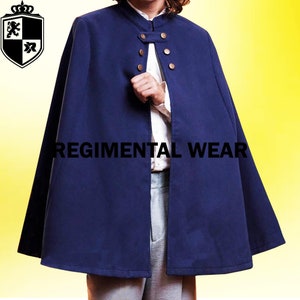 May include: A dark blue cape featuring a mandarin collar and a front closure with four metallic buttons. The garment displays the text REGIMENTAL WEAR across the center. A crest logo with a lion and crown icon is positioned in the top left corner.