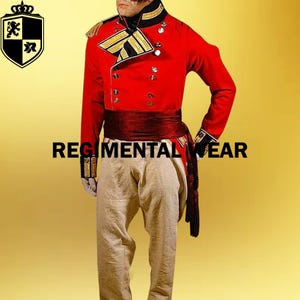 May include: A red military uniform with gold trim and a black sash. The uniform has a high collar and a double-breasted front. The pants are beige.