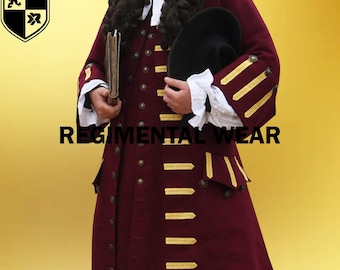 May include: A burgundy coat with gold trim and buttons. The coat has a long, flowing style and is worn by a person with a long, curly wig. The coat is a traditional style and is likely a costume.
