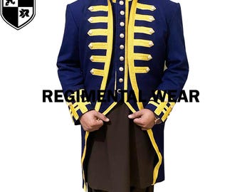 May include: A navy blue jacket with gold trim and buttons. The jacket has a high collar and a long, fitted style. The jacket is worn over a white shirt with a black vest.