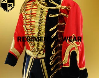 May include: A red military jacket with gold trim and black velvet accents. The jacket has a high collar and a row of gold buttons down the front. The jacket is decorated with gold braid and tassels. The text "REGIMENTAL WEAR" is visible on the jacket.