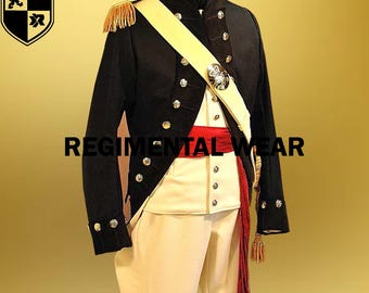 May include: A black military jacket with gold buttons and a white sash. The jacket has a high collar and is worn over a white shirt and white pants. A red sash is worn around the waist. The jacket is decorated with gold trim and a gold button.