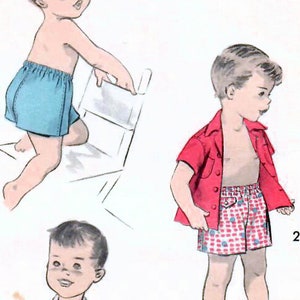 May include: A vintage sewing pattern for boys' shorts and shirts. The pattern includes three different styles: a pair of blue shorts, a pair of red and white checkered shorts, and a red short-sleeved shirt with a white and red checkered pattern. The pattern is labeled "Advance 7873, Size 2".