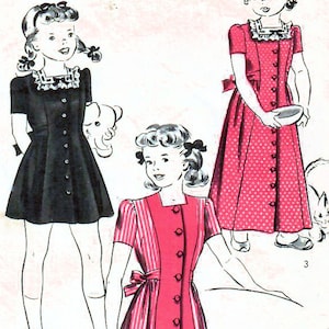May include: A vintage sewing pattern for a girl's dress. The pattern is for a dress with a button-up front, a collar, and short sleeves. The pattern is for a 4-year-old girl. The pattern number is 1456 and the price is 15 cents.