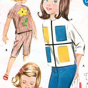May include: A vintage sewing pattern for children's clothing. The pattern includes three different outfits: a striped top and shorts, a white top with colorful geometric blocks, and a white top with a red gingham cat design. The pattern is for sizes 22 and 3. The pattern number is 2301.