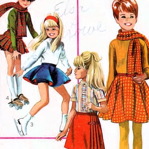 May include: A vintage Simplicity sewing pattern for girls' dresses. The pattern is for sizes 14 and includes three different dress styles. The dresses are all short and have a variety of colours and patterns. The pattern is from 1960 and is in good condition.