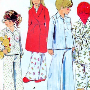 May include: A vintage sewing pattern for children's pajamas. The pattern includes three different styles: a red robe with a floral print, a blue and white striped pajama set, and a green and white floral pajama set. The pattern is from McCall's and is size 3.