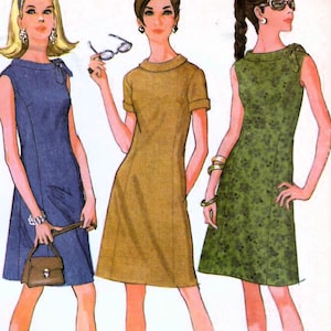 May include: A vintage sewing pattern for a dress in two versions. The pattern is from McCall's and is for size 14, bust 34. The pattern is called "Step-by-Step Pattern" and the number is 8951. The pattern shows three women wearing different versions of the dress. The dress on the left is blue, the dress in the middle is brown, and the dress on the right is green.